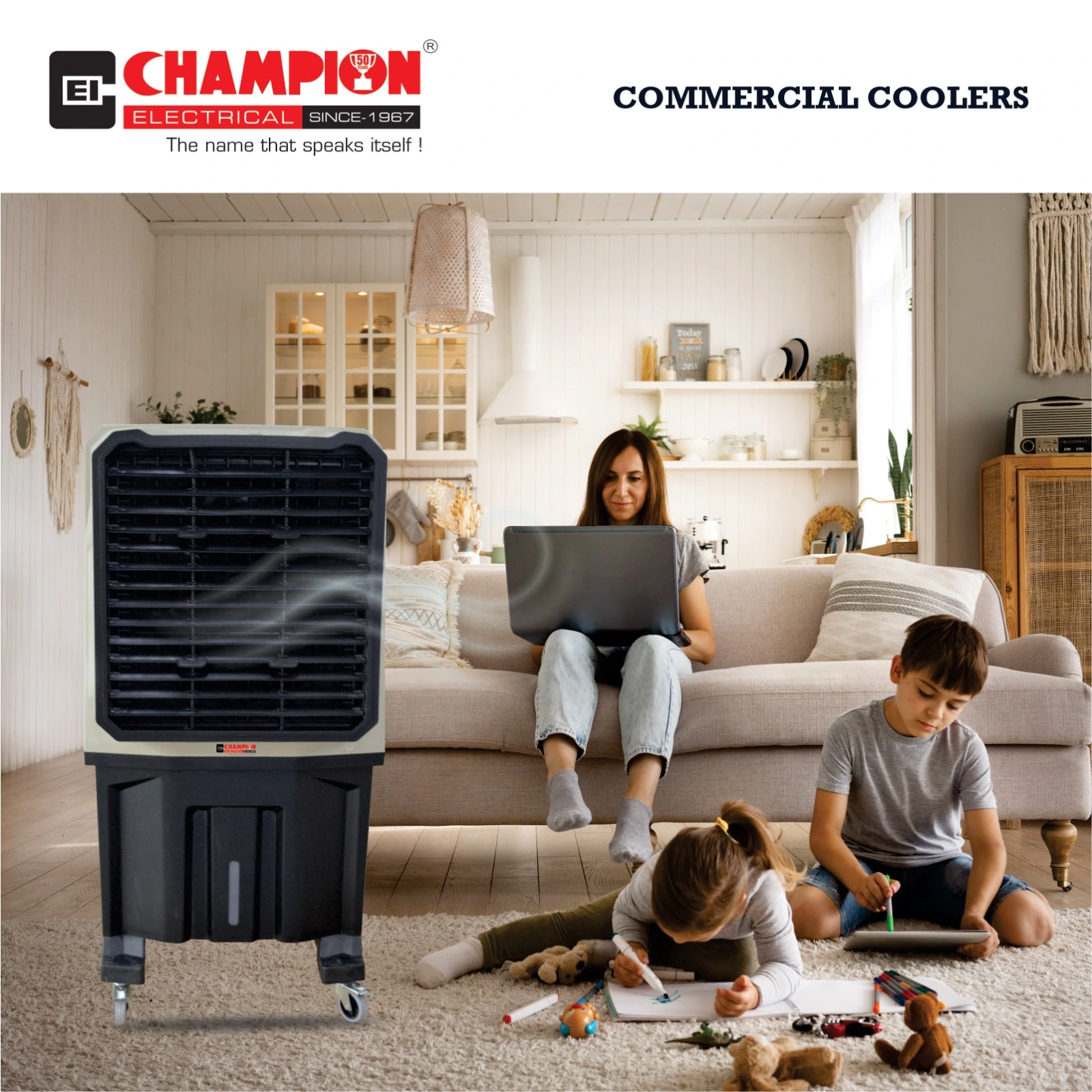 Two people sitting comfortably in a modern living room with a large Champion Electrical air cooler operating beside them.