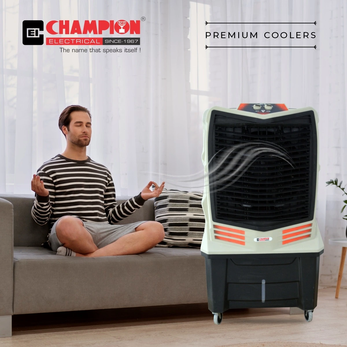 Person relaxing indoors next to a Champion Electrical air cooler with premium coolers branding.